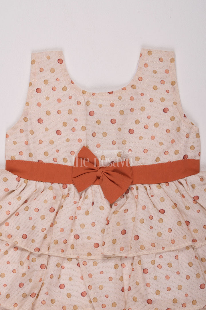 Girls Cream Brasso Polka Dot Dress with Rust Bow and Layered Skirt for Festive Gatherings