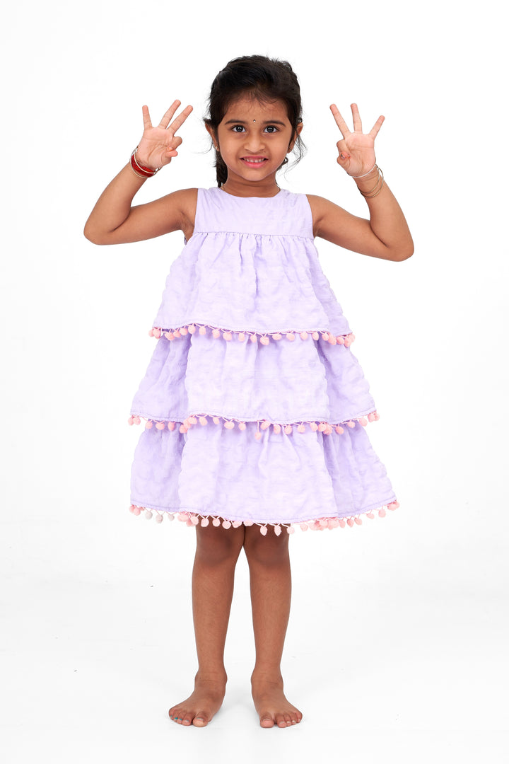 Lilac-Tiered Girls Fancy Frock with Pom-Pom Trim and Sleeveless Design for Parties