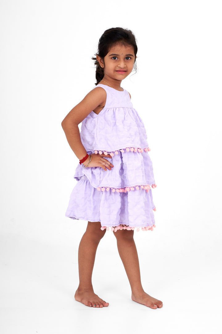 Lilac-Tiered Girls Fancy Frock with Pom-Pom Trim and Sleeveless Design for Parties