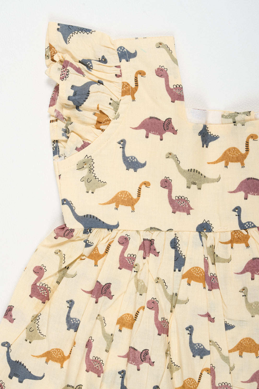 Beige Baby Cotton Frock with Dinosaur Print and Ruffled Sleeves Ideal for Playful Outings