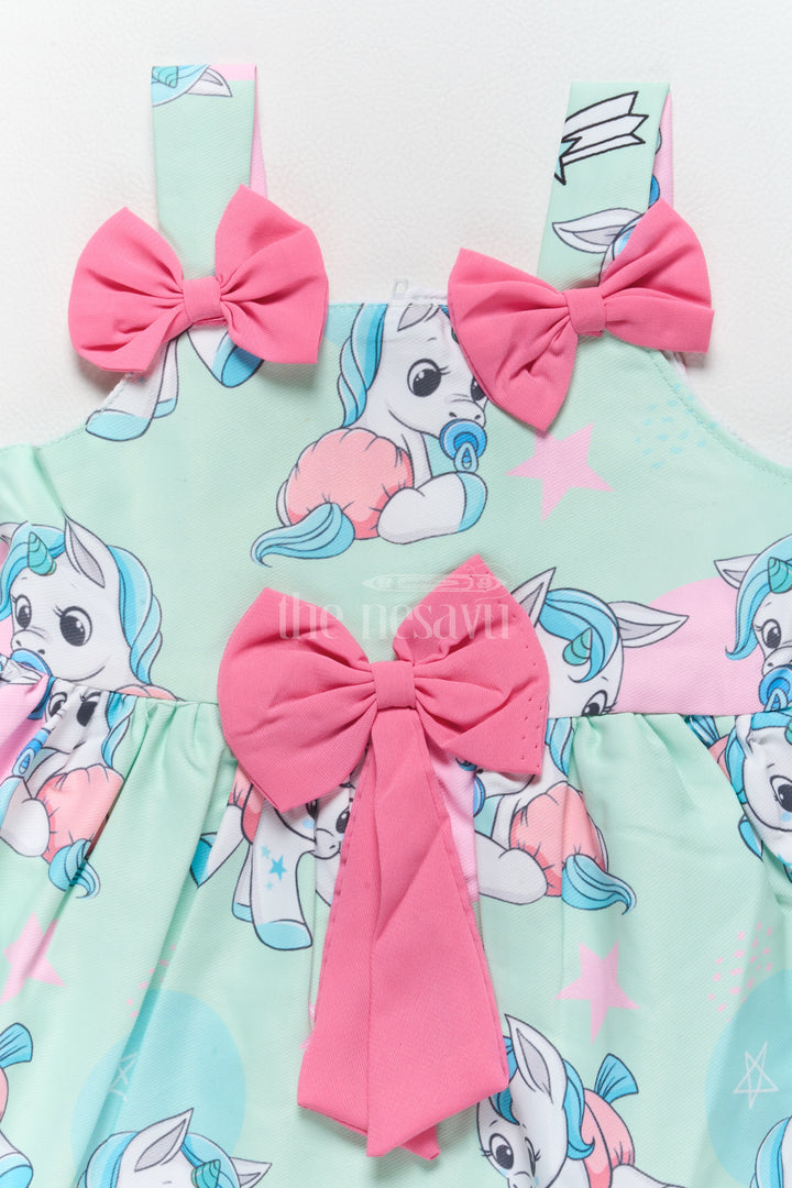 Baby Fancy Poly Crepe Simple Frock with Unicorn Prints and Pink Bow Accents