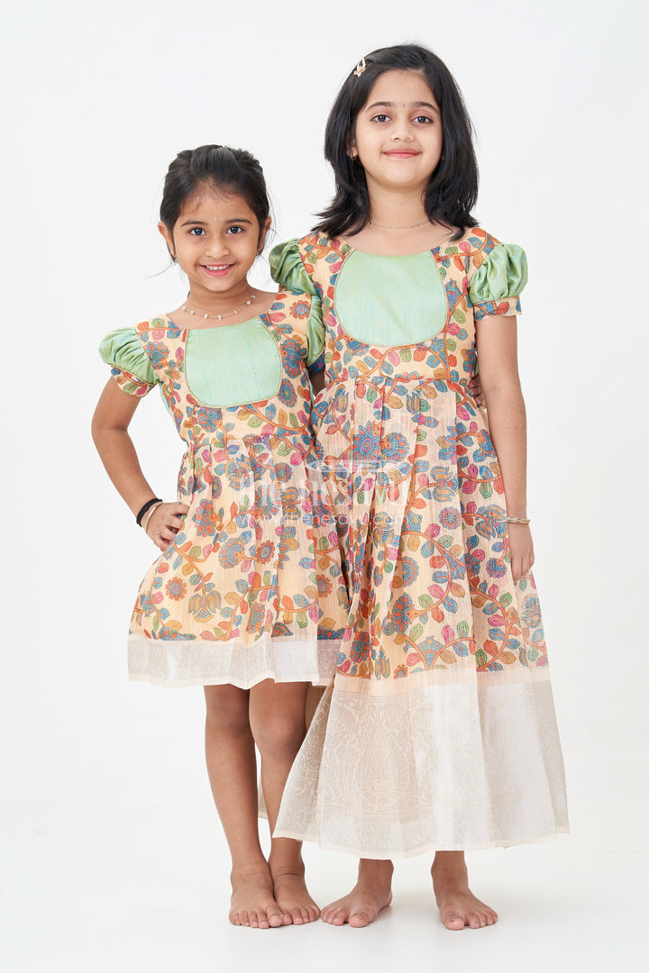 Yellow Gown Dress for Girls with Embroidered Floral Motifs and Raw Silk Yoke in Chanderi Cotton Blend