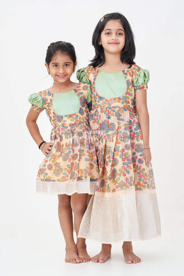 Yellow Gown Dress for Girls with Embroidered Floral Motifs and Raw Silk Yoke in Chanderi Cotton Blend
