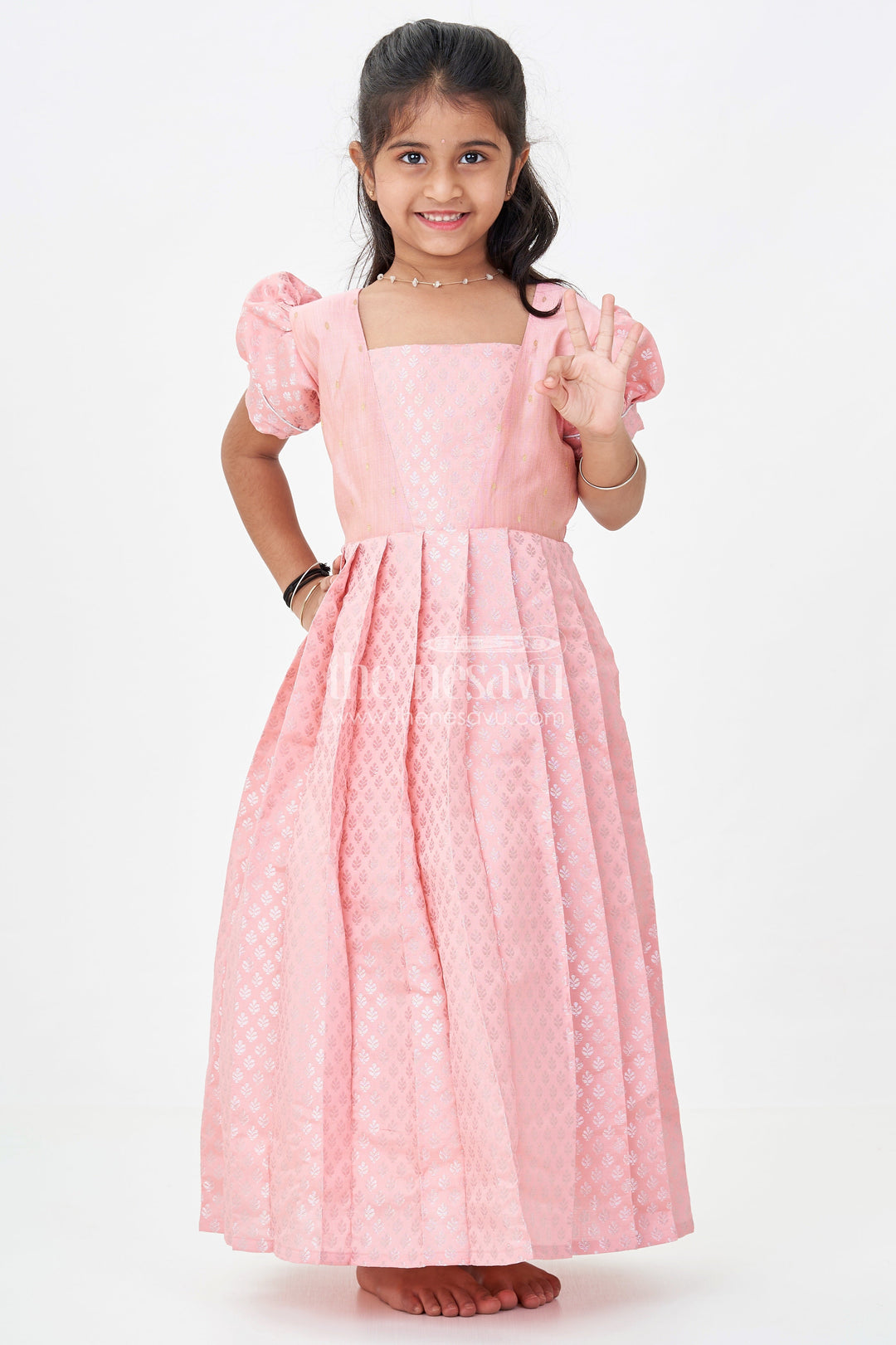 Girls Semi Banaras Silk Pink Party Wear Gown with Intricate Woven Motifs and Classic Puff Sleeves
