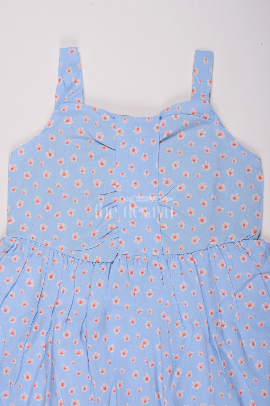 Girls Cotton Frock Online with Dainty Floral Prints in Light Blue Muslin Fabric