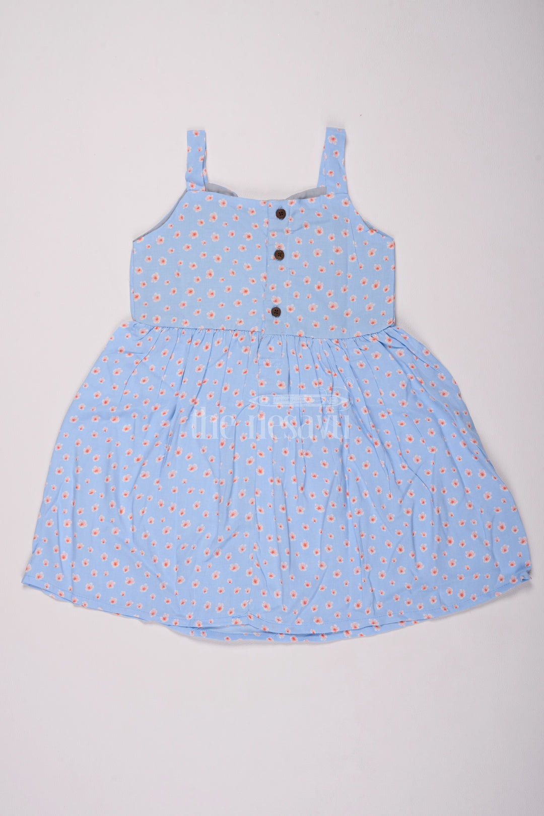 Girls Cotton Frock Online with Dainty Floral Prints in Light Blue Muslin Fabric