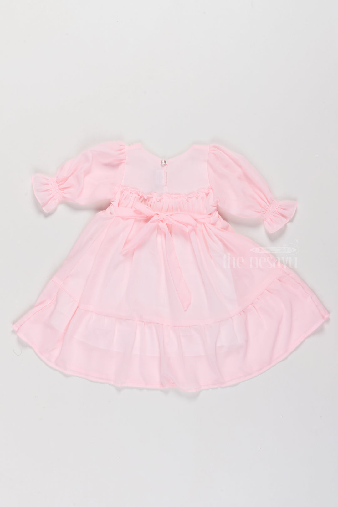 Girls Formal Dresses in Soft Pink with Smocked Detailing and Puff Sleeves