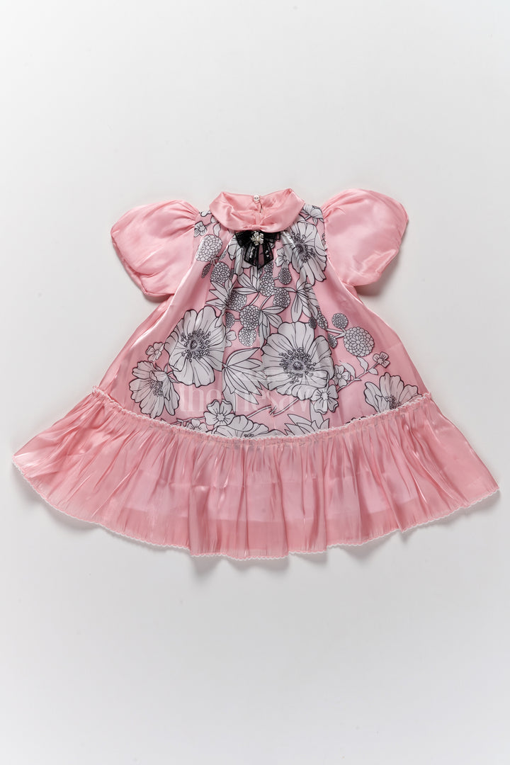 Elegant Girls Fancy Frock in Pink Georgette Fabric with Floral Print and Ruffled Hemline