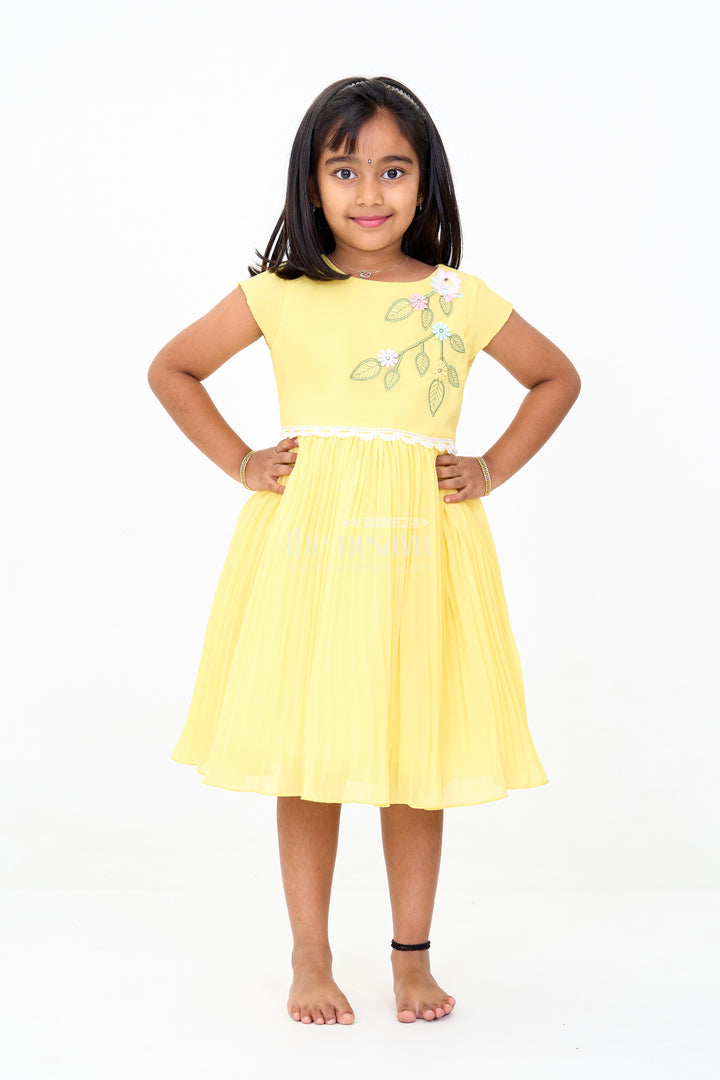 Girls Poly Georgette Frock in Sunshine Yellow with Floral Embellishments and Pleats