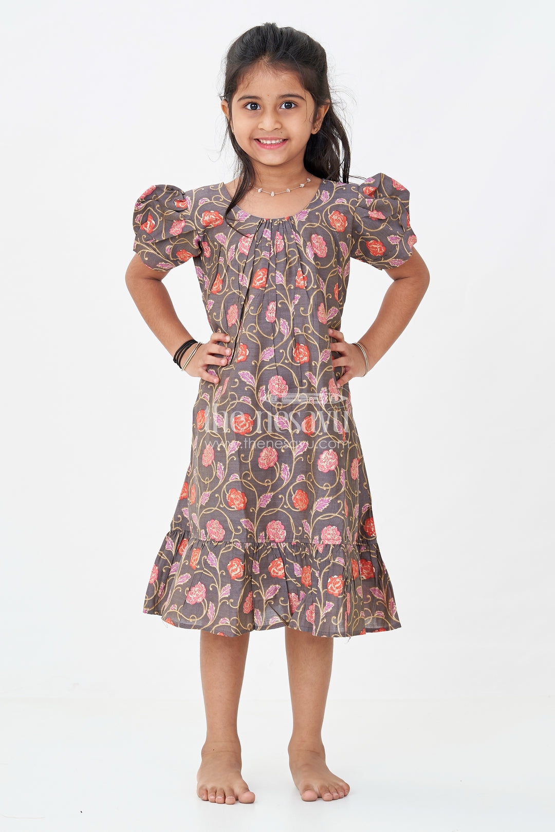 Girls Small Frock Design in Brown Muslin Silk with Red Floral Print and Flared Ruffle Hem