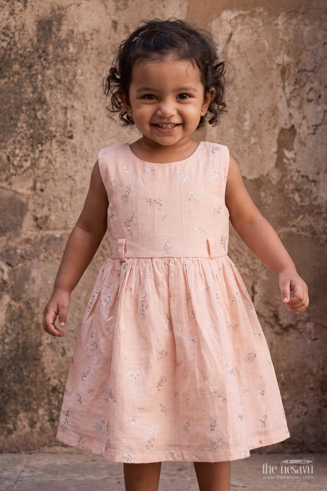 Girls Muslin Cotton Frock in Pale Peach with Silver Foil Motif