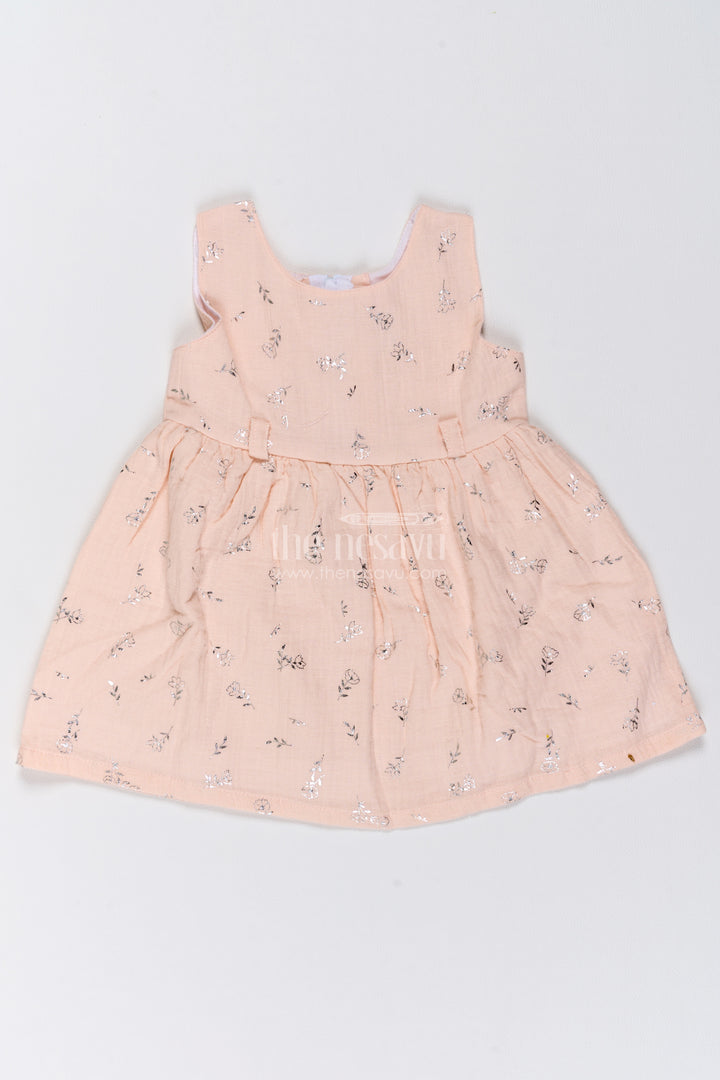 Girls Muslin Cotton Frock in Pale Peach with Silver Foil Motif