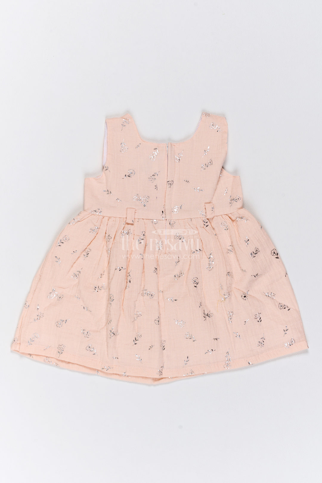 Girls Muslin Cotton Frock in Pale Peach with Silver Foil Motif