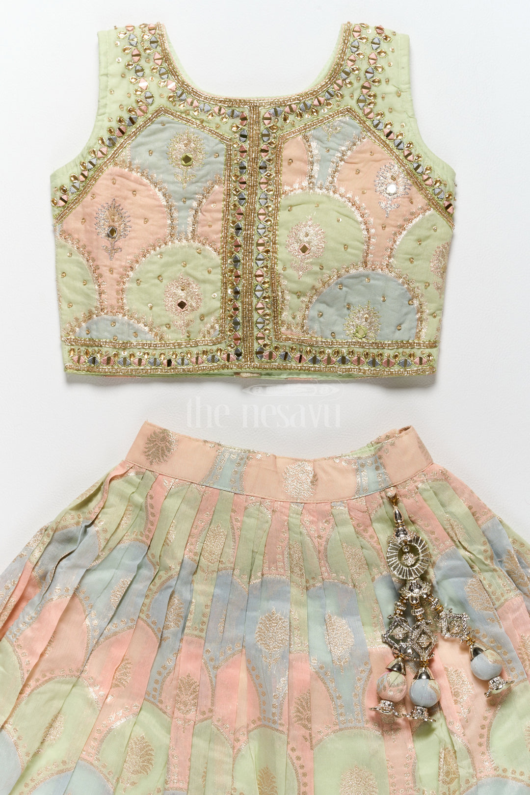 Girls Lehenga Designs in Pastel Hues with Muslin Silk and Golden Border