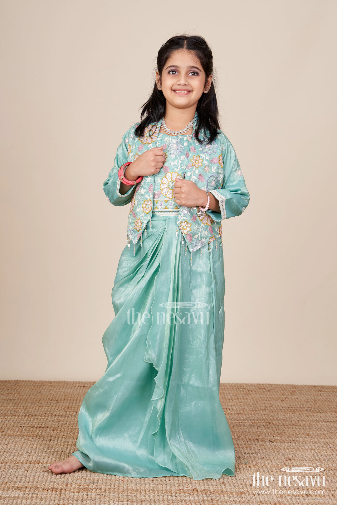 Girls green organza lehenga choli with designer embroidered yoke for festive occasions