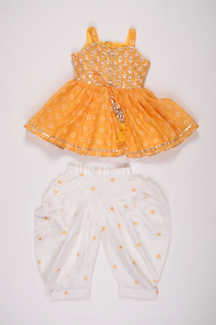 Girls Mustard Chinon Silk Peplum Set with White Dhoti Pants and Sleeveless Top for Festive Occasions