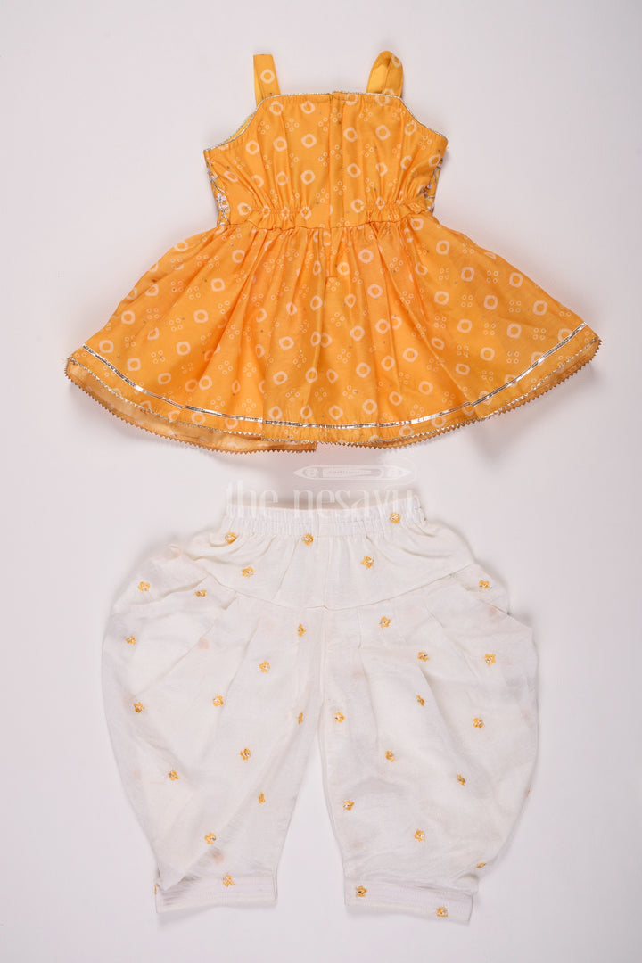 Girls Mustard Chinon Silk Peplum Set with White Dhoti Pants and Sleeveless Top for Festive Occasions