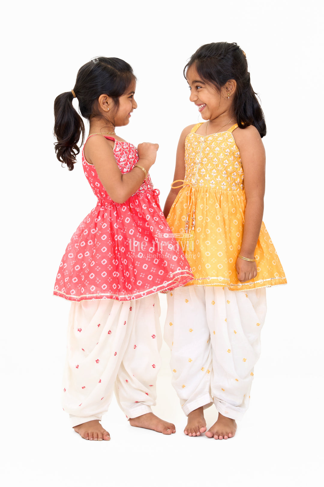 Girls Mustard Chinon Silk Peplum Set with White Dhoti Pants and Sleeveless Top for Festive Occasions