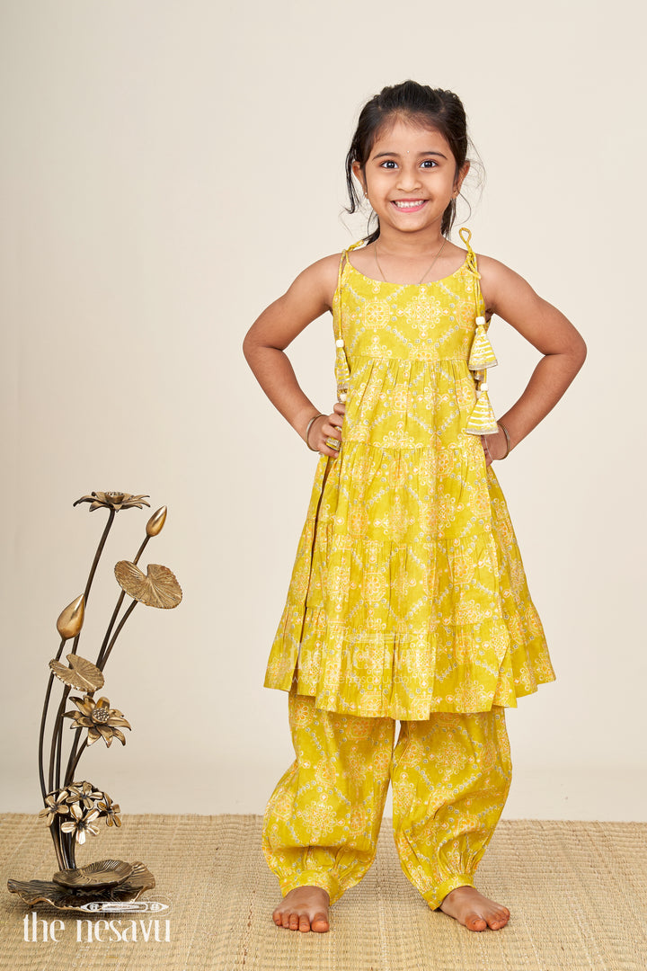 Girls yellow sharara set with printed tiered kurti for festive dressing