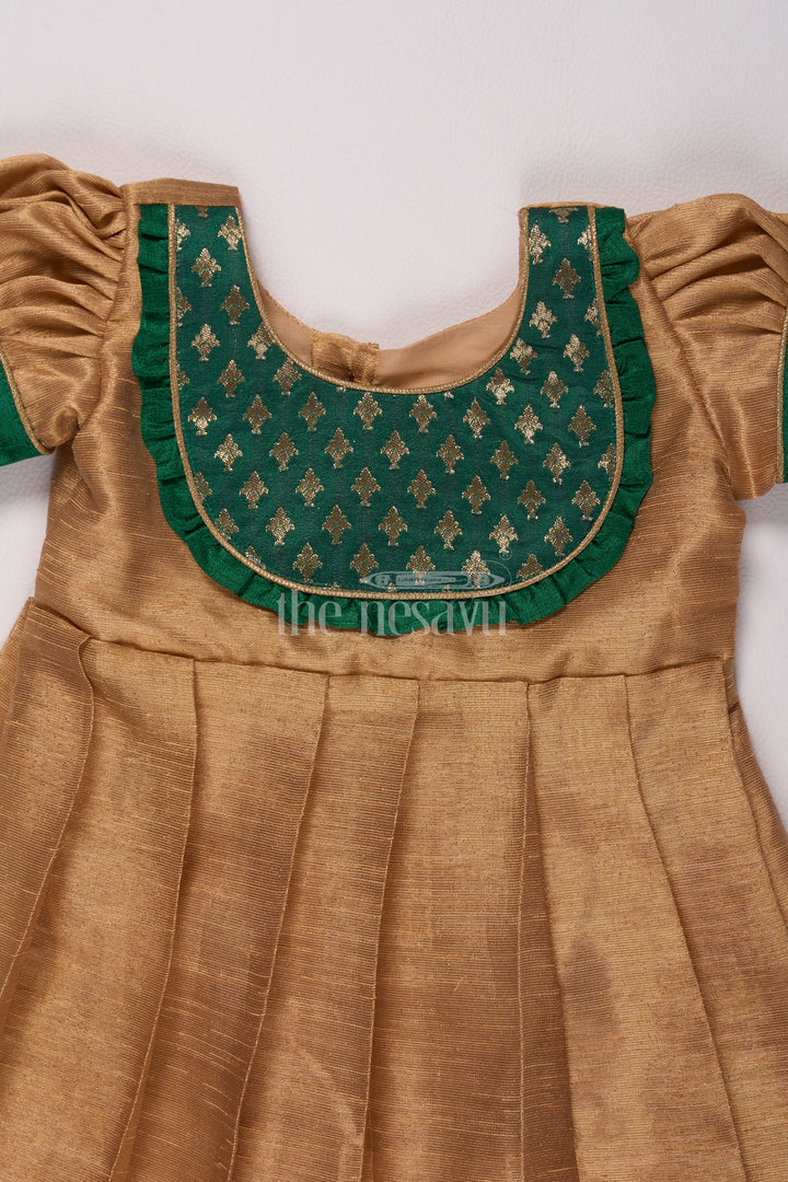 Radiant Gold Long Frock Pattu for Girls with Green Bib Yoke and Silver Tissue Fabric