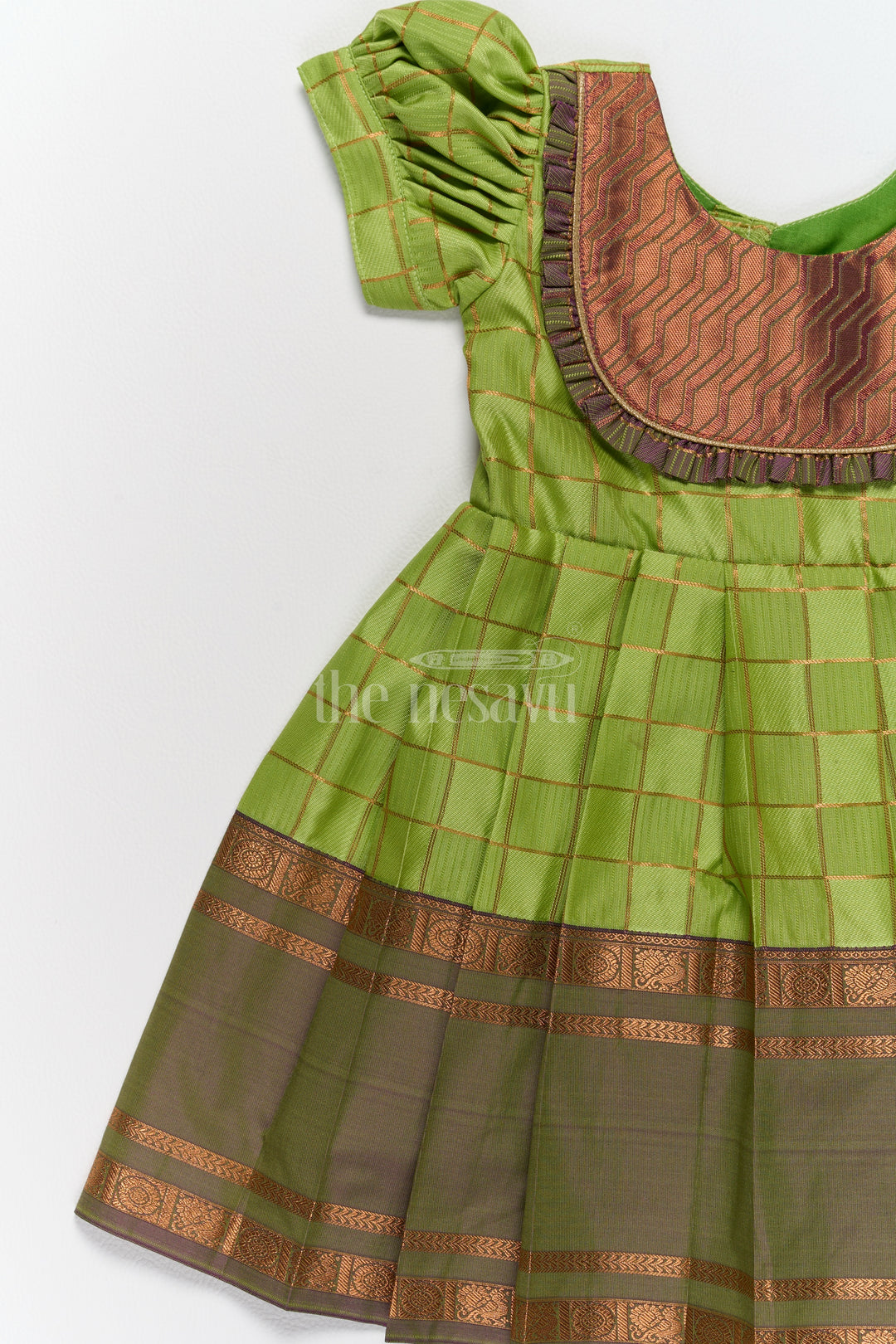 Vibrant Green Pattu Long Frock for Girls with Golden Checkered Pattern and Ruffled Yoke