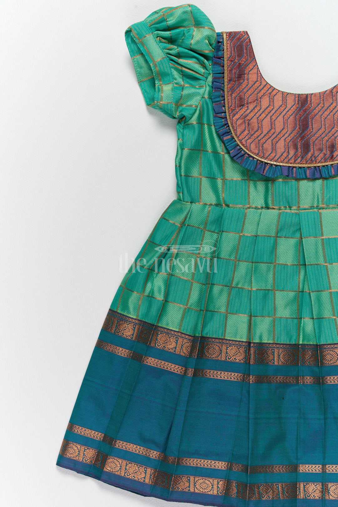 Vibrant Green Pattu Long Frock for Girls with Golden Checkered Pattern and Ruffled Yoke