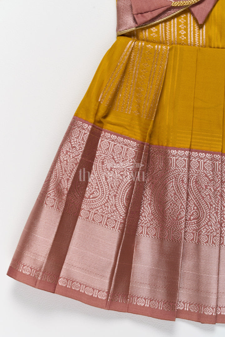 Charming Yellow and Brown Girls Kanchi Silk Frock with Traditional Brocade for Pongal