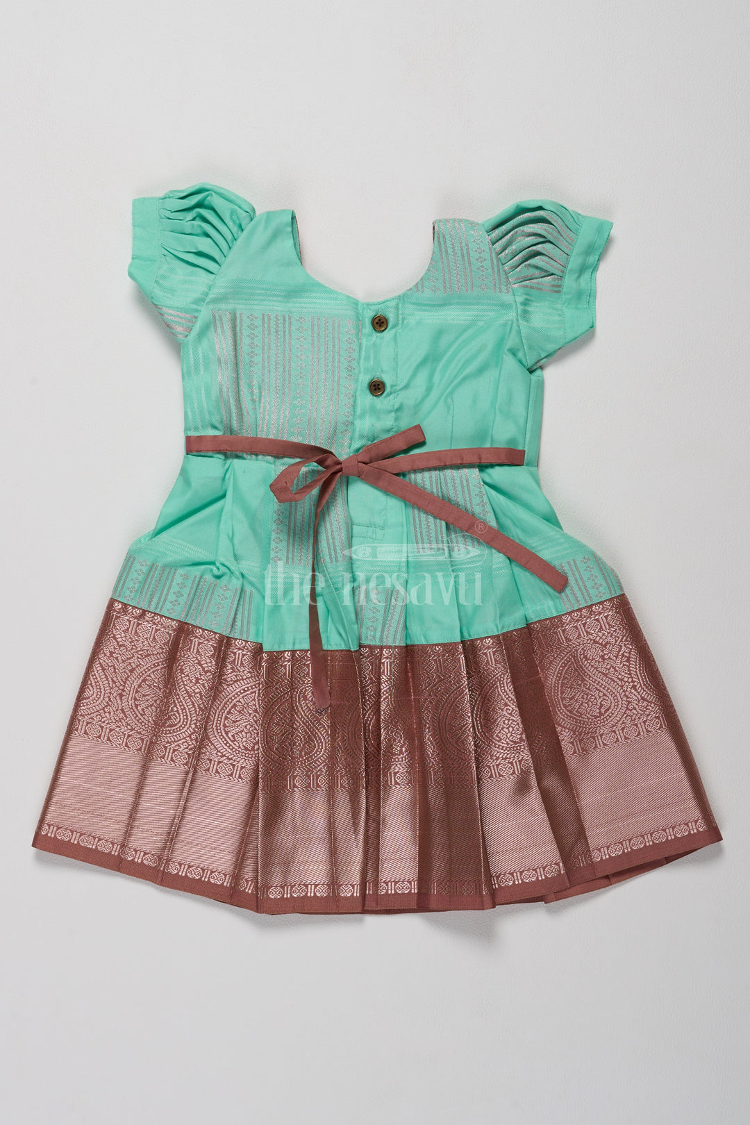 Elegant Mint Green Pattu Frock Design for Girls with Bronze Yoke in Blend Silk