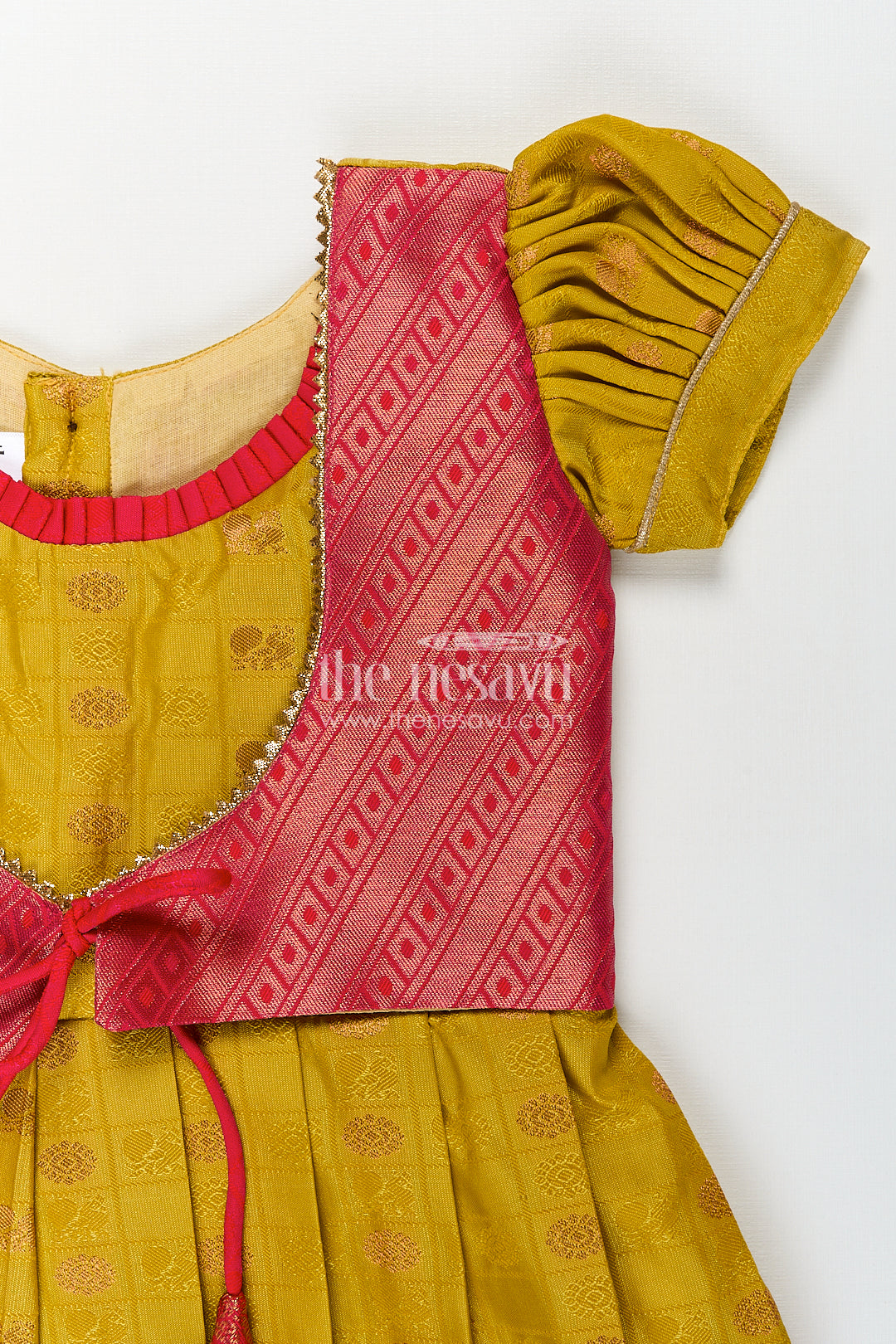 Girls Kanchivaram Yellow Silk Frock with Puff Sleeves and Contrast Maroon Zari Woven Border Design