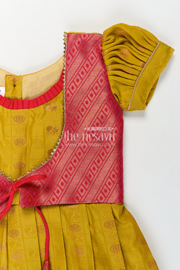 Girls Kanchivaram Yellow Silk Frock with Puff Sleeves and Contrast Maroon Zari Woven Border Design