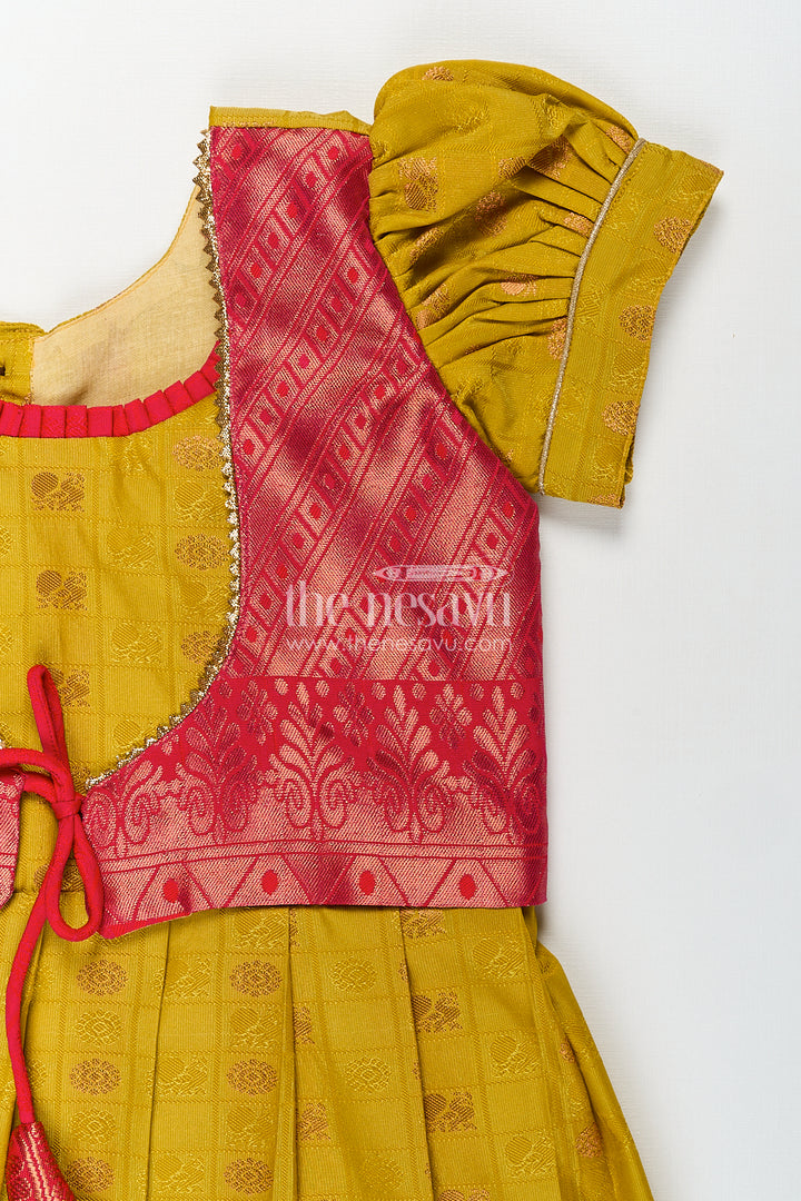 Girls Kanchivaram Yellow Silk Frock with Puff Sleeves and Contrast Maroon Zari Woven Border Design