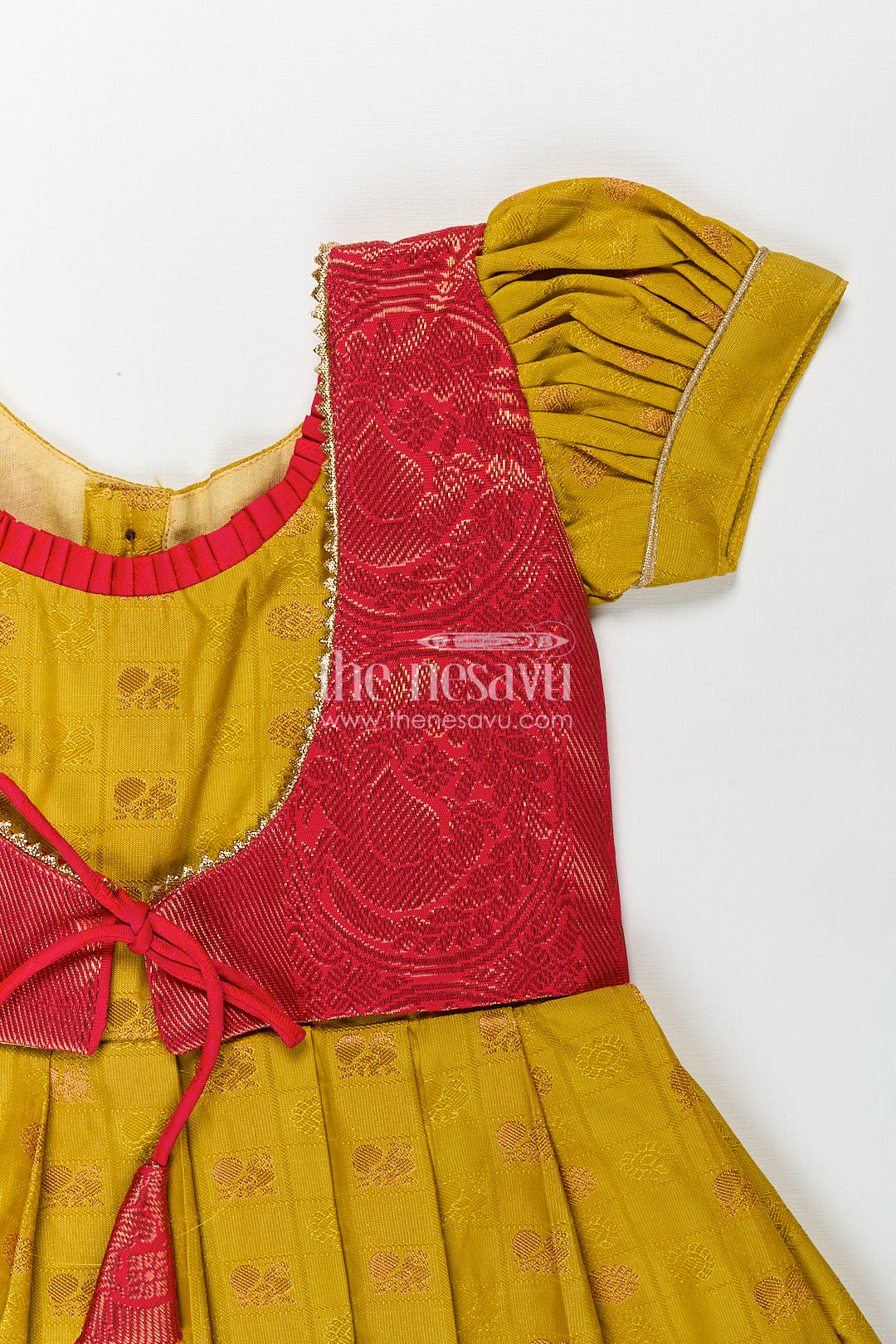 Girls Kanchivaram Yellow Silk Frock with Puff Sleeves and Contrast Maroon Zari Woven Border Design