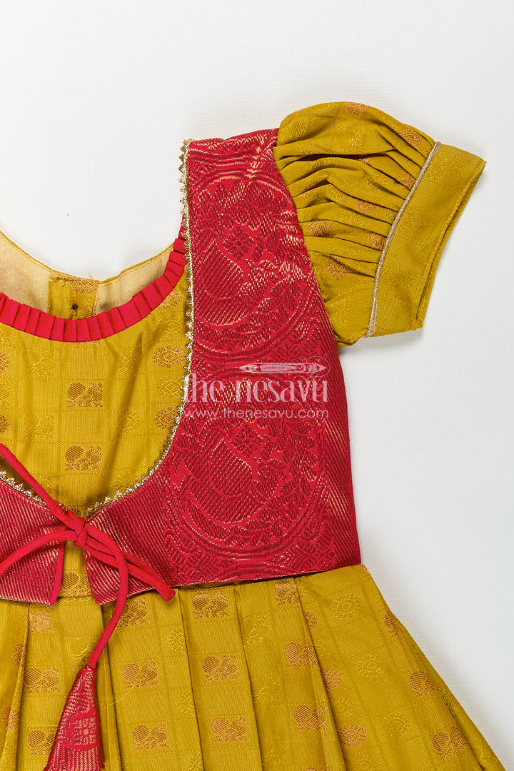 Girls Kanchivaram Yellow Silk Frock with Puff Sleeves and Contrast Maroon Zari Woven Border Design