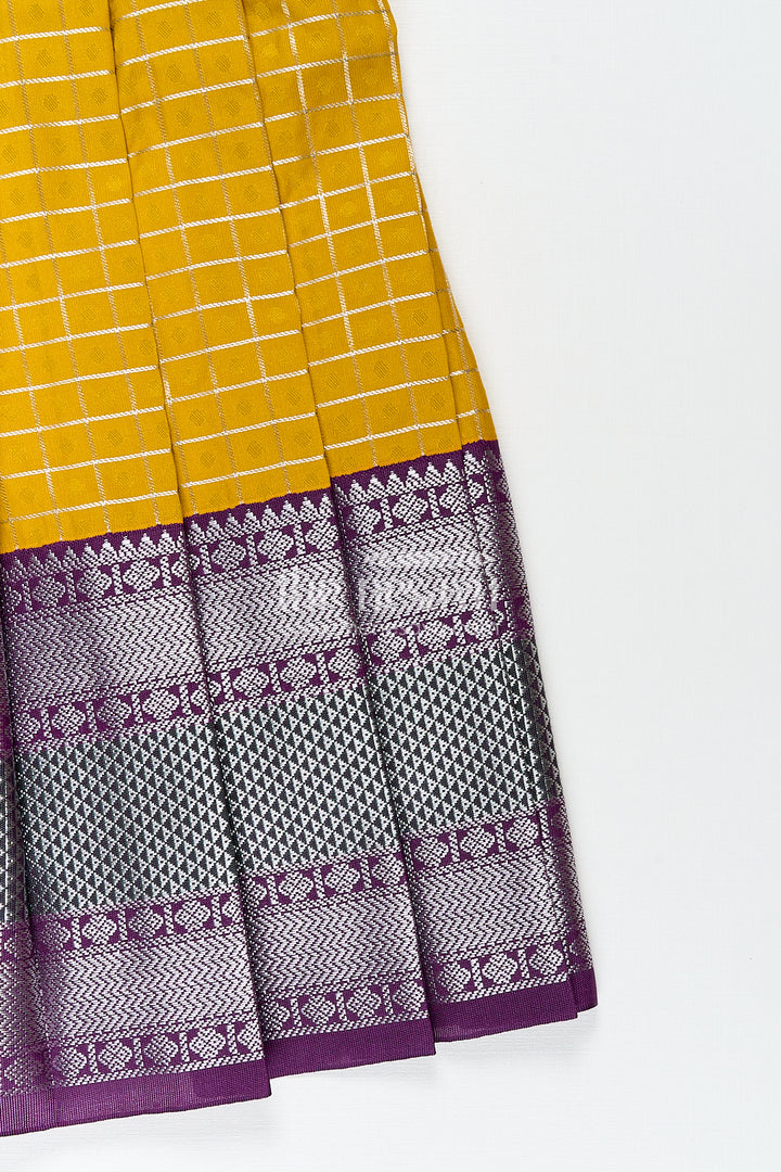 Girls Kanchivaram Traditional Dress Frock in Mustard Yellow with Puff Sleeves and Purple Zari Border