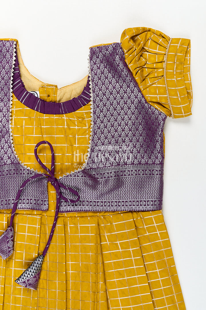 Girls Kanchivaram Traditional Dress Frock in Mustard Yellow with Puff Sleeves and Purple Zari Border