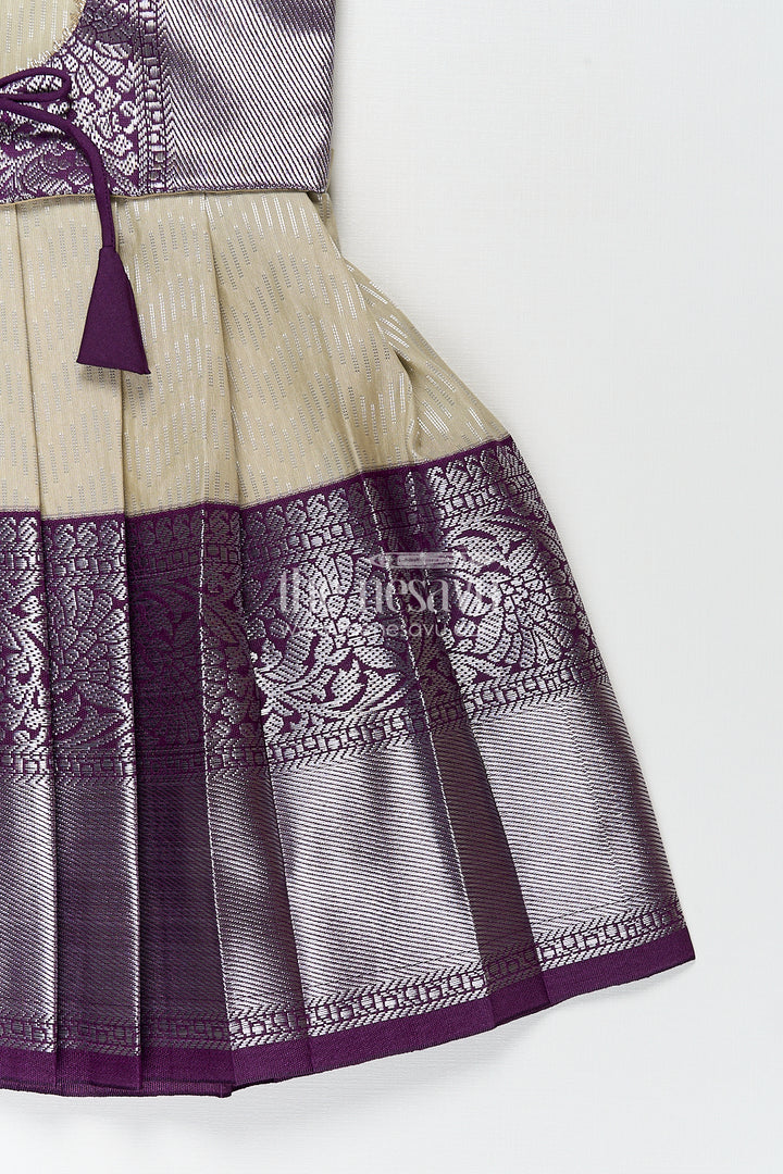 Girls Kanchivaram Frock Traditional in Cream and Purple with Puff Sleeves and Zari Woven Border