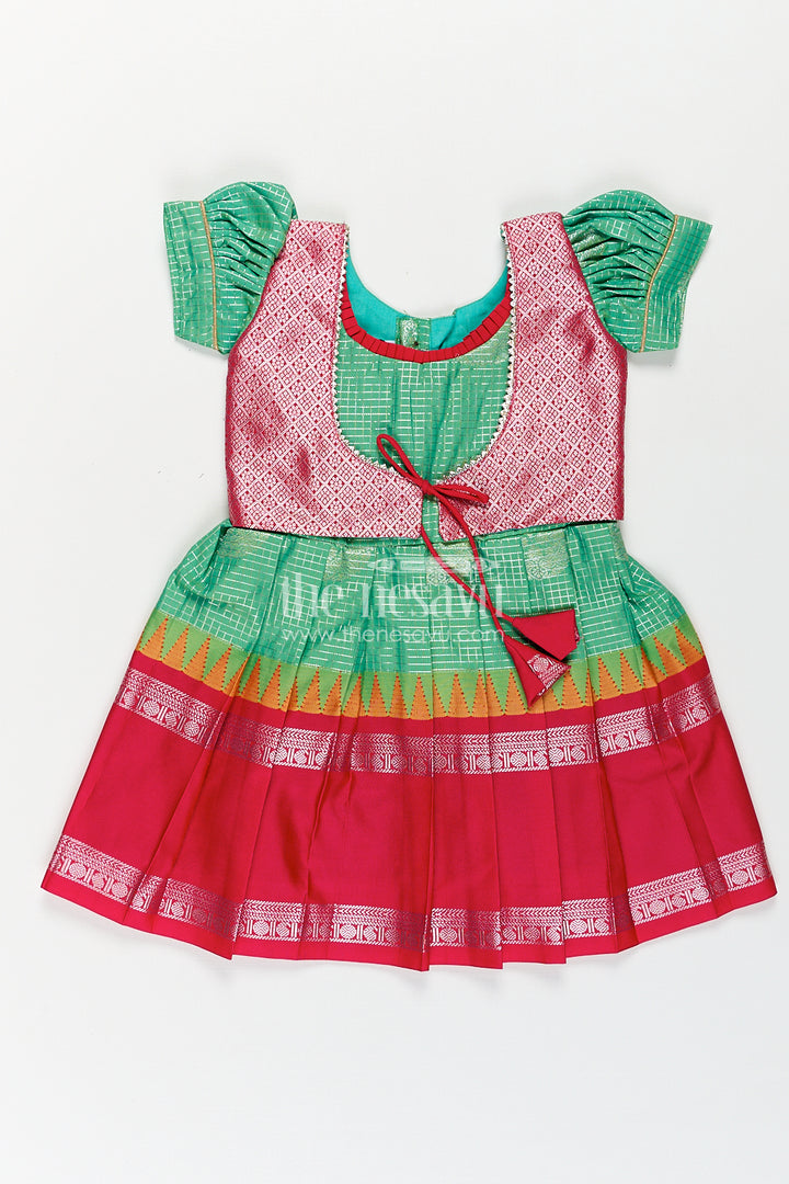 Girls Silk Material Frock Design in Semi Kanchivaram with Green Pleated Skirt and Pink Brocade Yoke