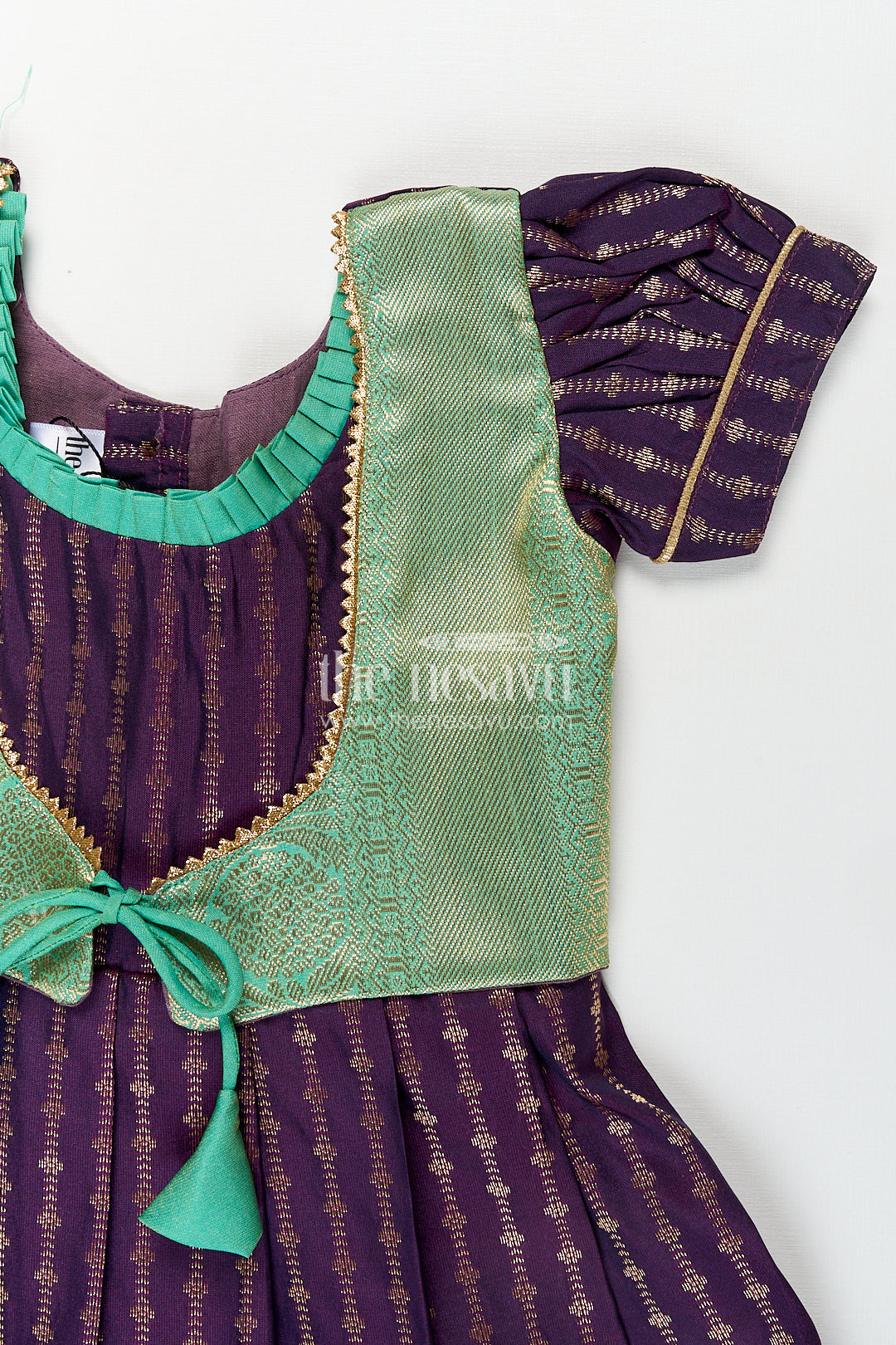 Girls Kanchivaram Long Green Frock with Puff Sleeves in Purple and Zari Woven Skirt and Overlay Detail