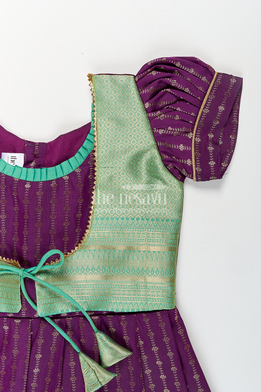 Girls Kanchivaram Long Green Frock with Puff Sleeves in Purple and Zari Woven Skirt and Overlay Detail