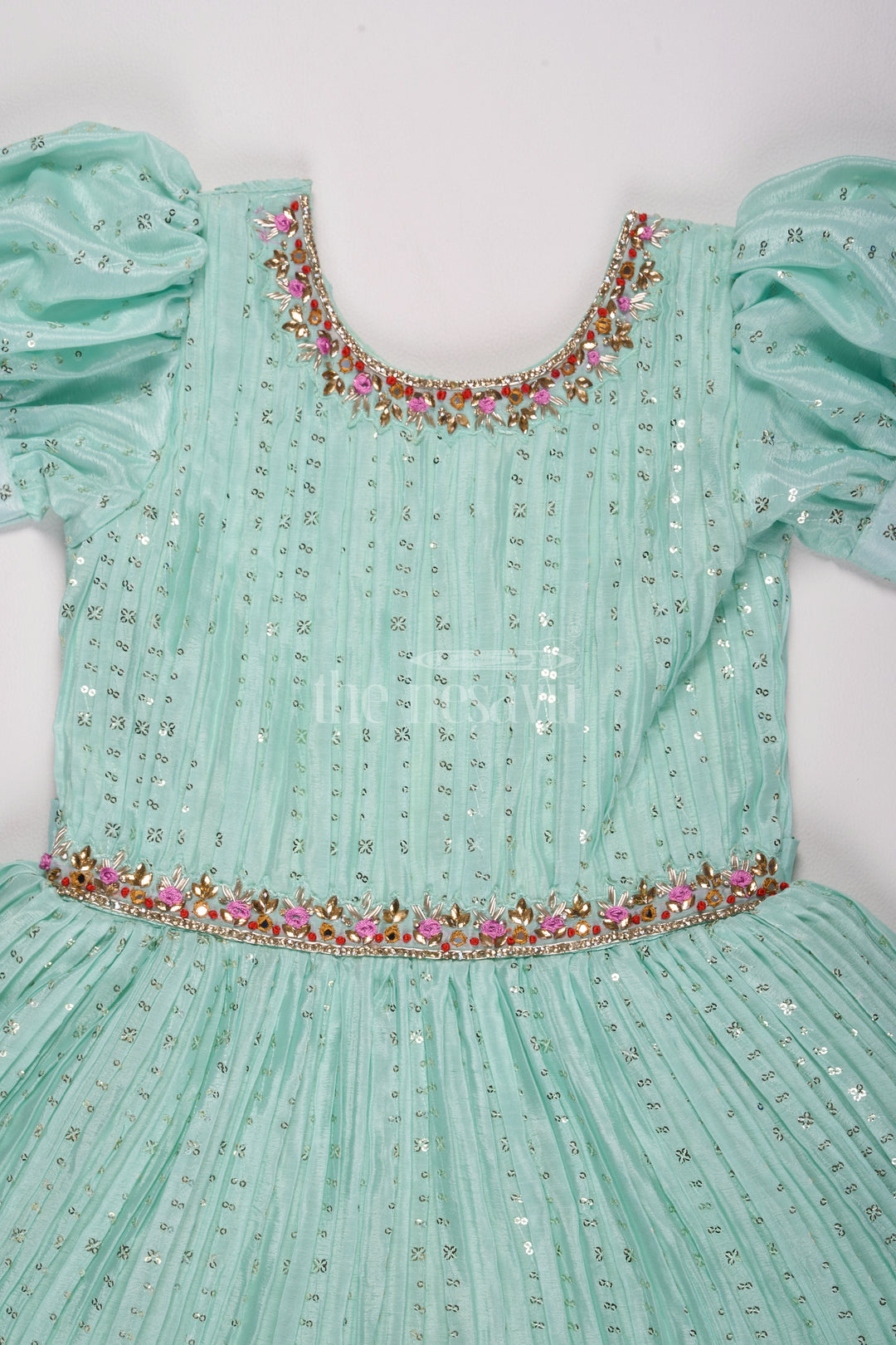 Mint Green Girls Fancy Frock with Floral Embellishments and Vibrant Border for Parties