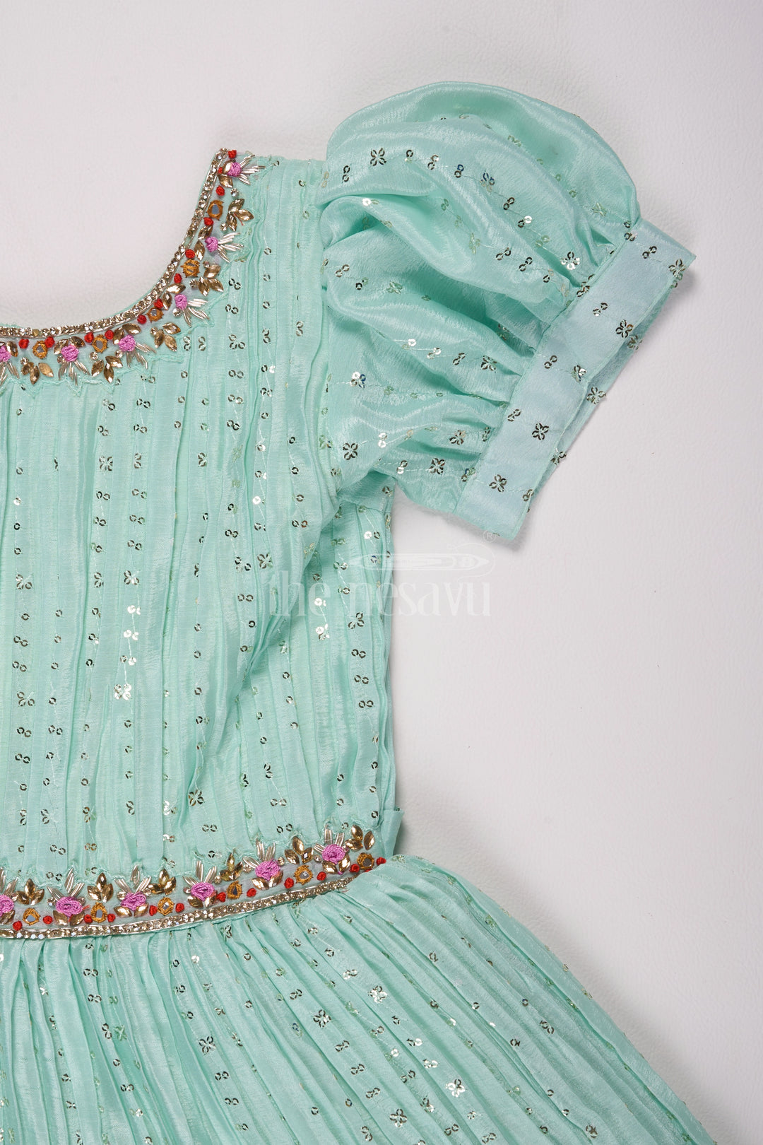 Mint Green Girls Fancy Frock with Floral Embellishments and Vibrant Border for Parties