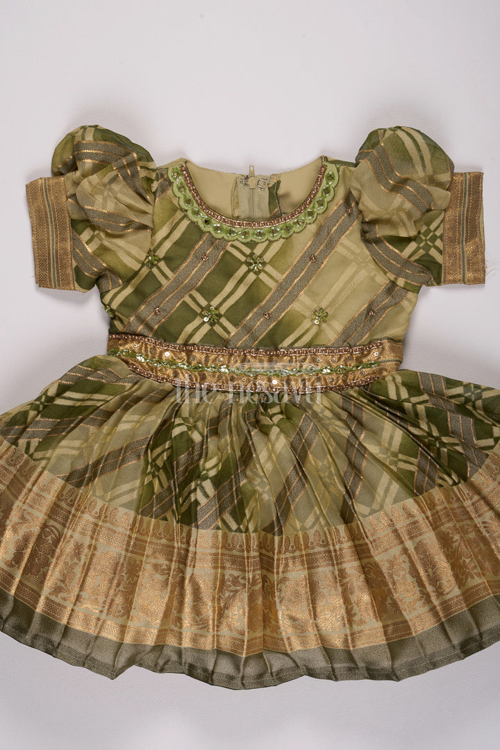 Girls Fancy Frock in Green Tissue Silk with Floral Embellishments and Short Pleated Skirt