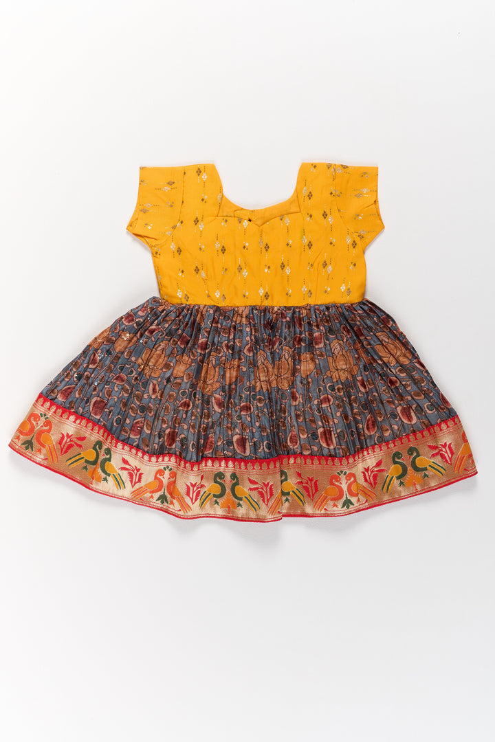 Girls Yellow Pattu Pavadai with Traditional Printed Border and Contrast Skirt for Festive Wear