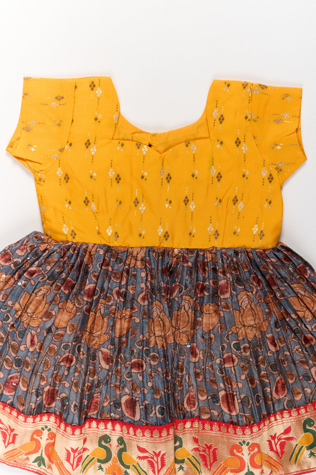 Girls Yellow Pattu Pavadai with Traditional Printed Border and Contrast Skirt for Festive Wear