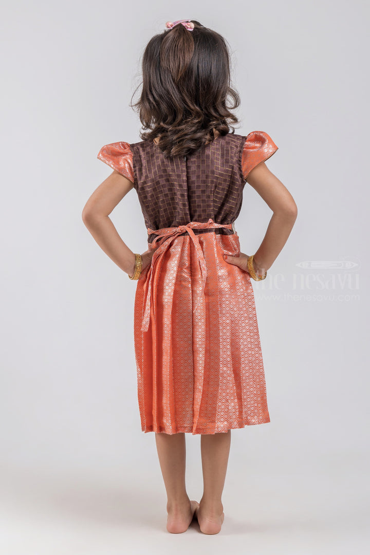 The Nesavu Silk Embroidered Frock Adorable Checked Pattern Dark Brown Yoke and Knife Pleated Zari With Geometrical Designer Orange Silk Frock for Girls psr silks Nesavu