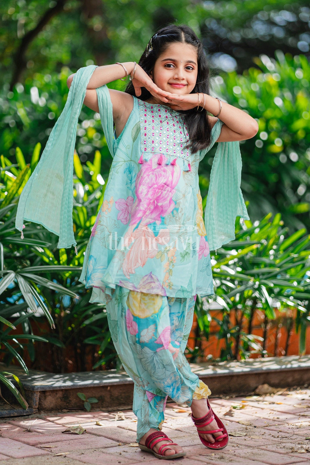 The Nesavu Girls Dothi Sets Aqua Floral Kurta and Dhoti Set for Girls with Sleeveless Kurta and Embellished Yoke Nesavu Nesavu Aqua Floral Girls Dhoti Set Sleeveless Kurta Tassel Embellishments