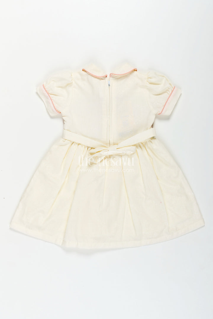 The Nesavu Girls Cotton Frock Archive -Girls Short Frock White Colour with Smocked Rainbow Yoke and Peter Pan Collar in Soft Cotton Blend Nesavu Nesavu Girls Short Frock White Colour Rainbow Smocked Yoke Peter Pan Collar