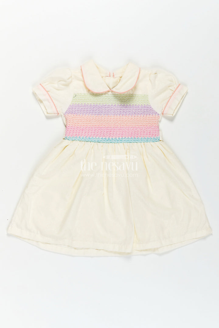 The Nesavu Girls Cotton Frock Archive -Girls Short Frock White Colour with Smocked Rainbow Yoke and Peter Pan Collar in Soft Cotton Blend Nesavu Nesavu Girls Short Frock White Colour Rainbow Smocked Yoke Peter Pan Collar
