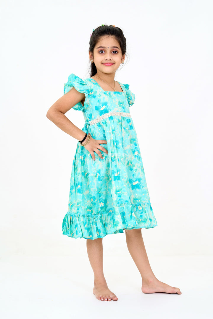 The Nesavu Girls Cotton Frock Baby Cotton Hug Clothing with Blue Floral Prints and Ruffled Design Nesavu Baby Cotton Hug Clothing Floral Prints Ruffled Hem Blue | The Nesavu