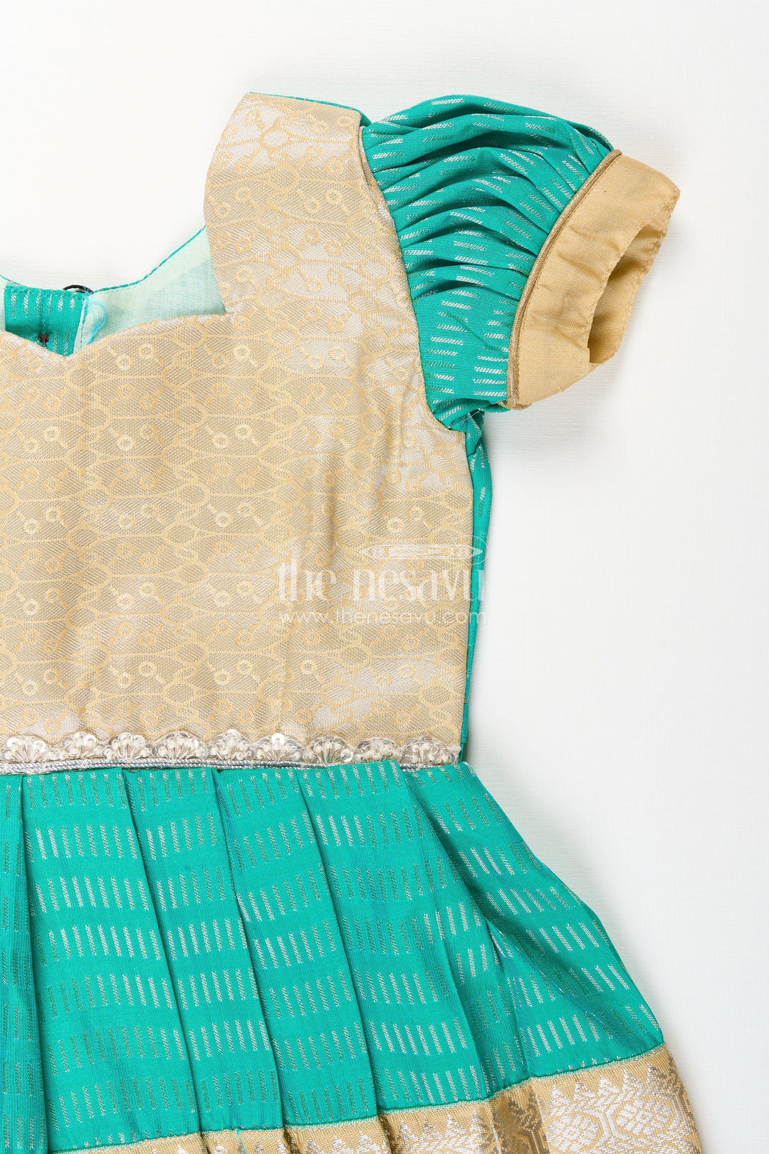 The Nesavu Girls Kanchi Silk Frock Baby girl kanchipuram silk frock for weddings and festive occasions Nesavu Nesavu baby girl kanchipuram silk frock in green and gold with lace detail for festive celebrations